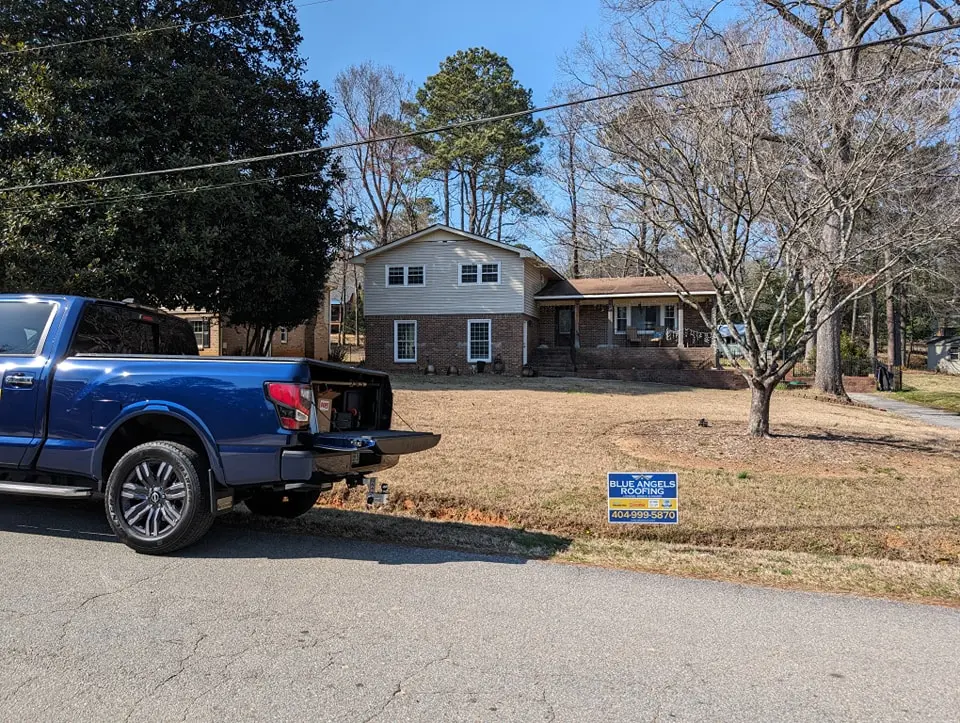 Blue Angels Roofing team installing chimney flashing and crickets in Alabama and Georgia to prevent water damage and improve roof performance.