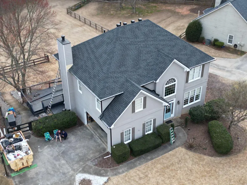 Blue Angels Roofing team performing professional exterior painting in Alabama and Georgia, enhancing curb appeal and protecting building surfaces.